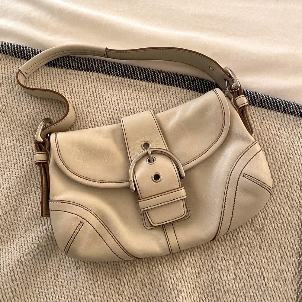 White coach bag with silver metals